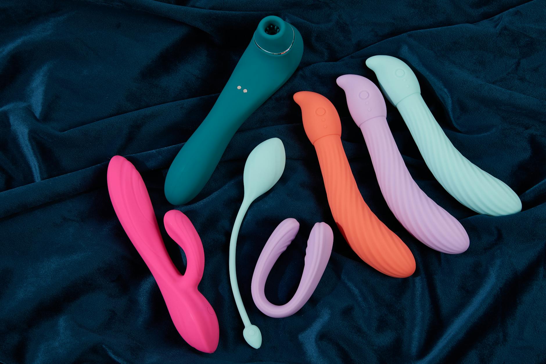 A person thoughtfully examining vibrators, considering options for restoring sensation.